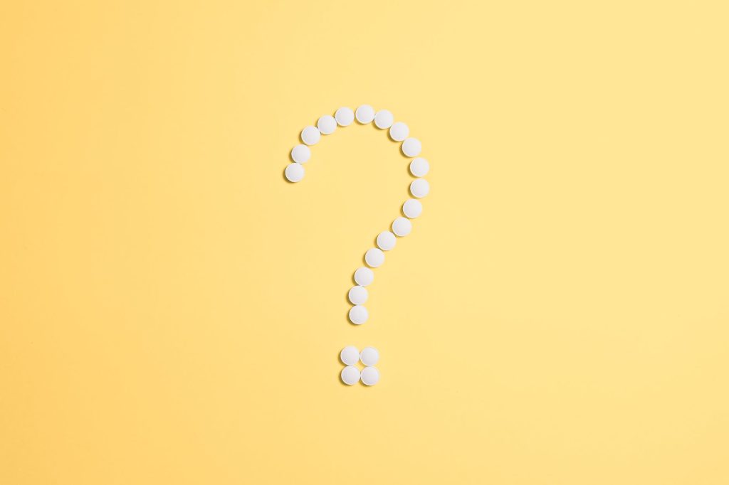 pills fixed as question mark sign